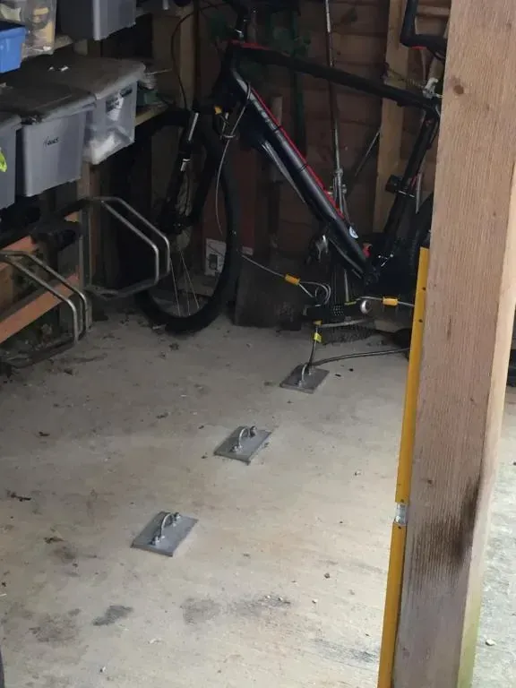 Covered bicycle storage with floor locking points at The Old Rectory
