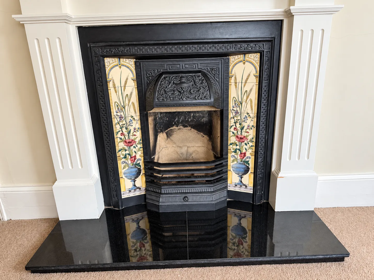 Green Room decorative fireplace with floral tiles