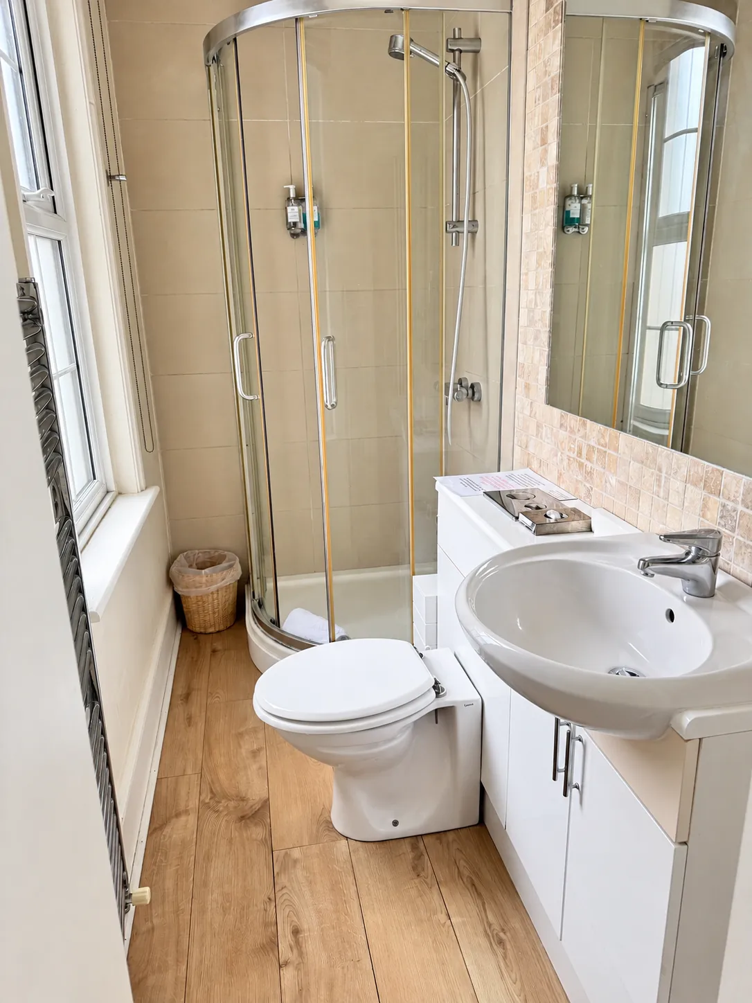 Green Room shower and basin beside the window